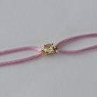 pulsera-tina-oro-amarillo-cuerda-rosa